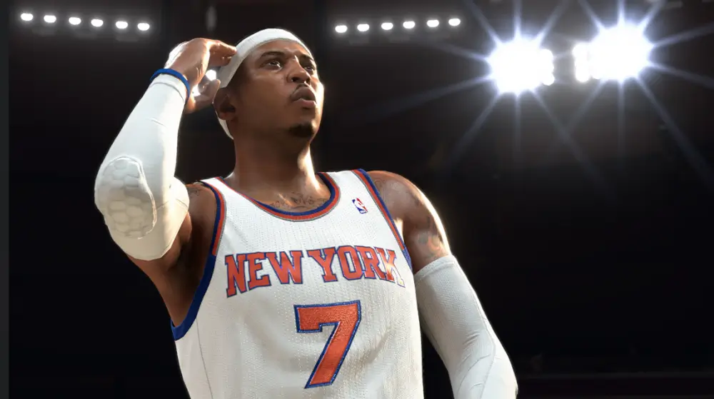NBA 2K26  אחד השחקנים על מגרש הכדורסל מאחוריו יש אורות לבנים של המגרש